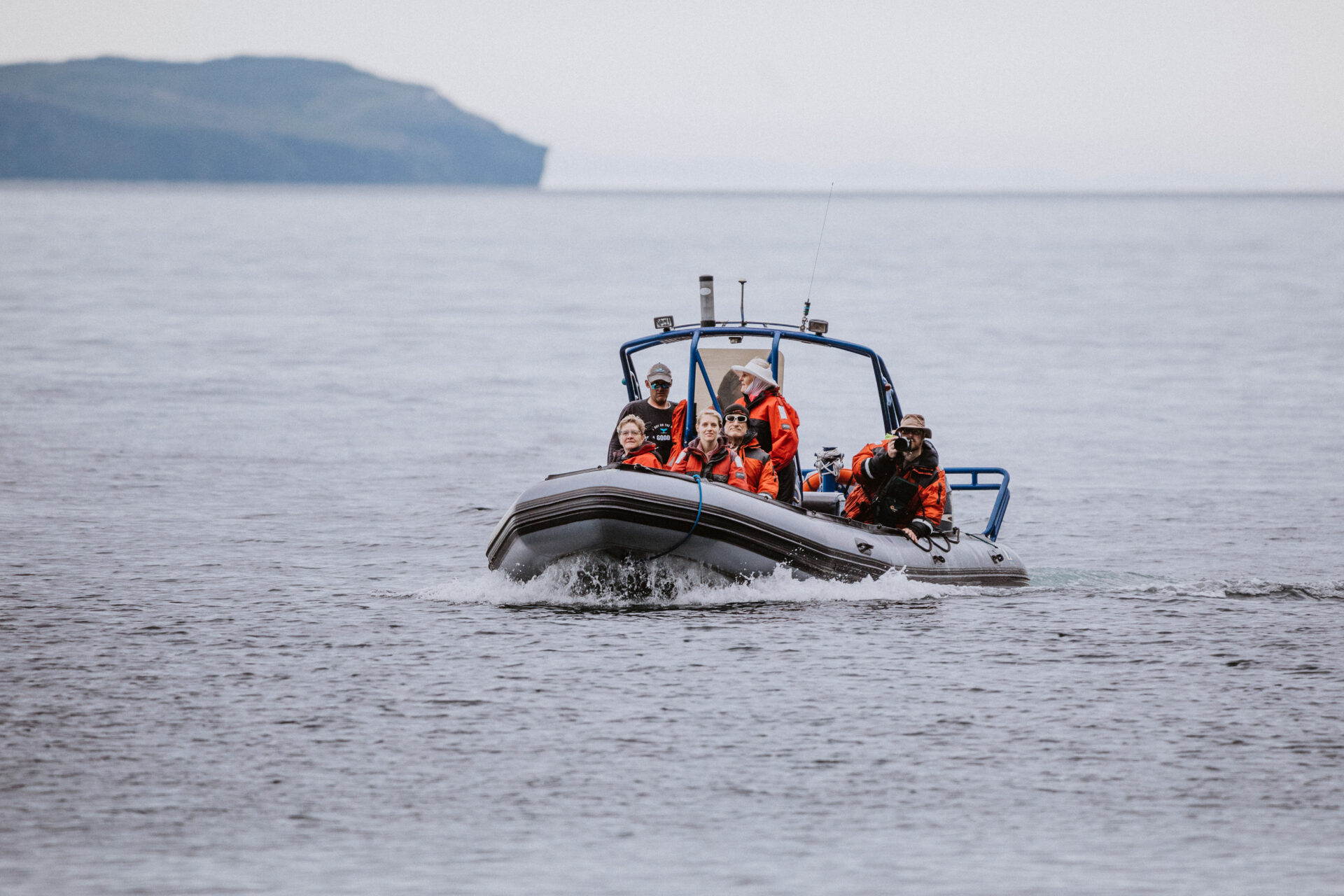 Sea Of Whales Adventures zodiac boat tour cruises the Bonavista peninsula, filled with excited whale watching adventurers