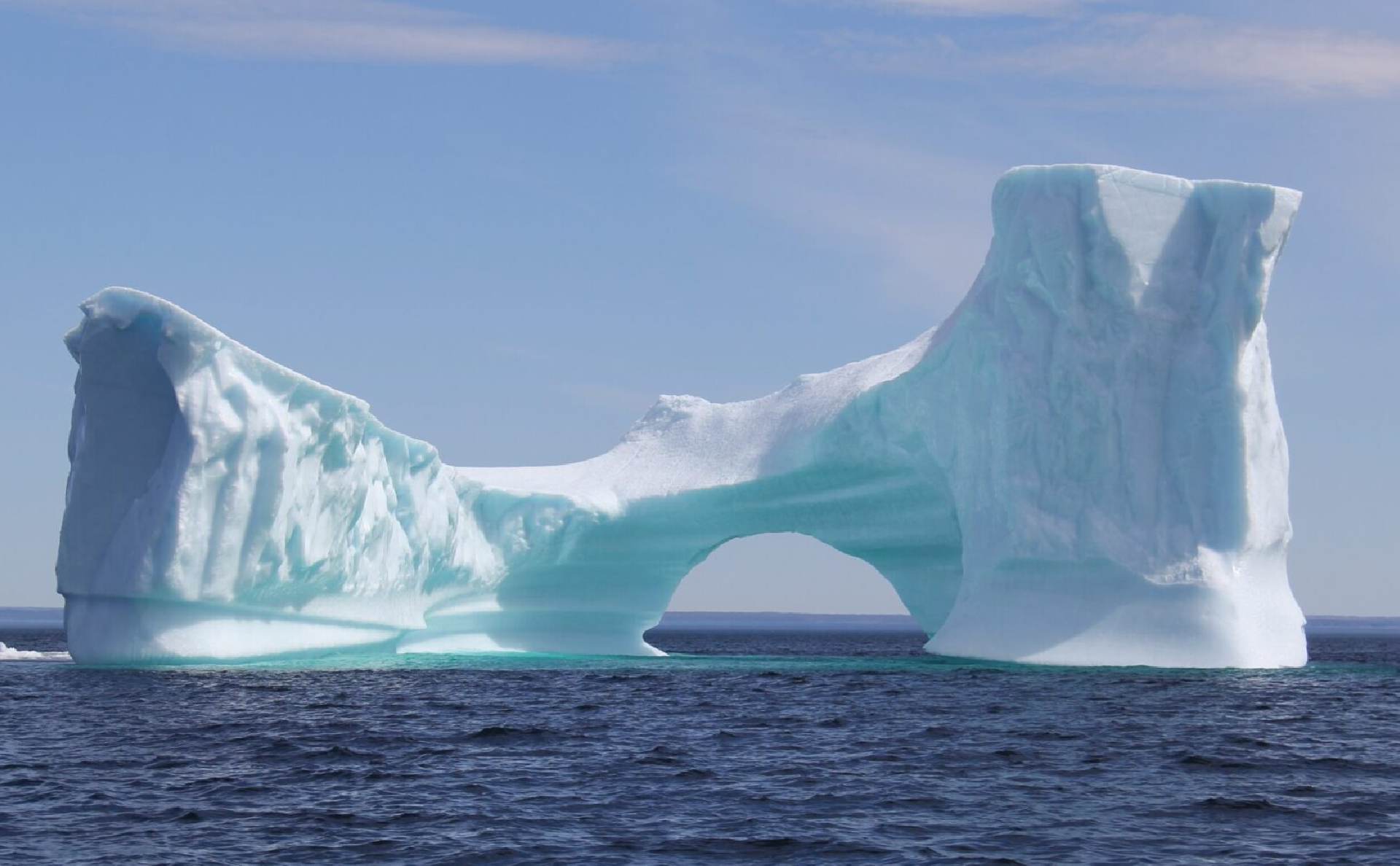 A beautiful iceberg in the middle of an ocean