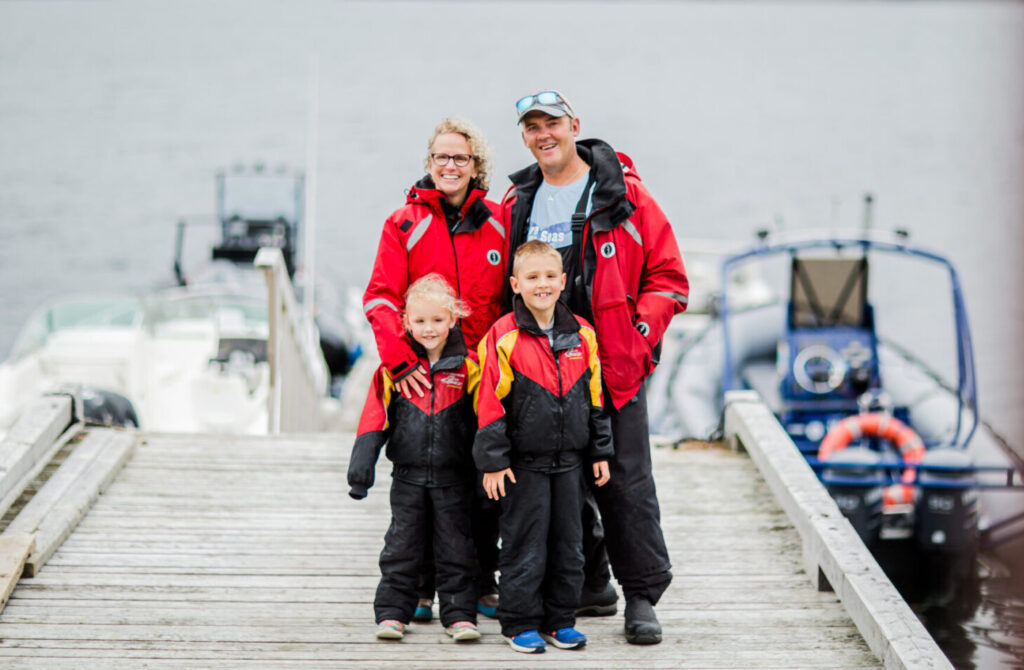 family friendly whale boat tours. Photo features Kris and Shawna Prince of Sea of Whales adventures with their children.